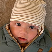 Louis a rejoint le concours — aidez-le/la à gagner de superbes lots ! baby, child, face, hat, beanie, jacket, clothing, cute, portrait, infant, eyes, mouth, skin, warm, cozy, expression, indoor, young, headwear, zipper