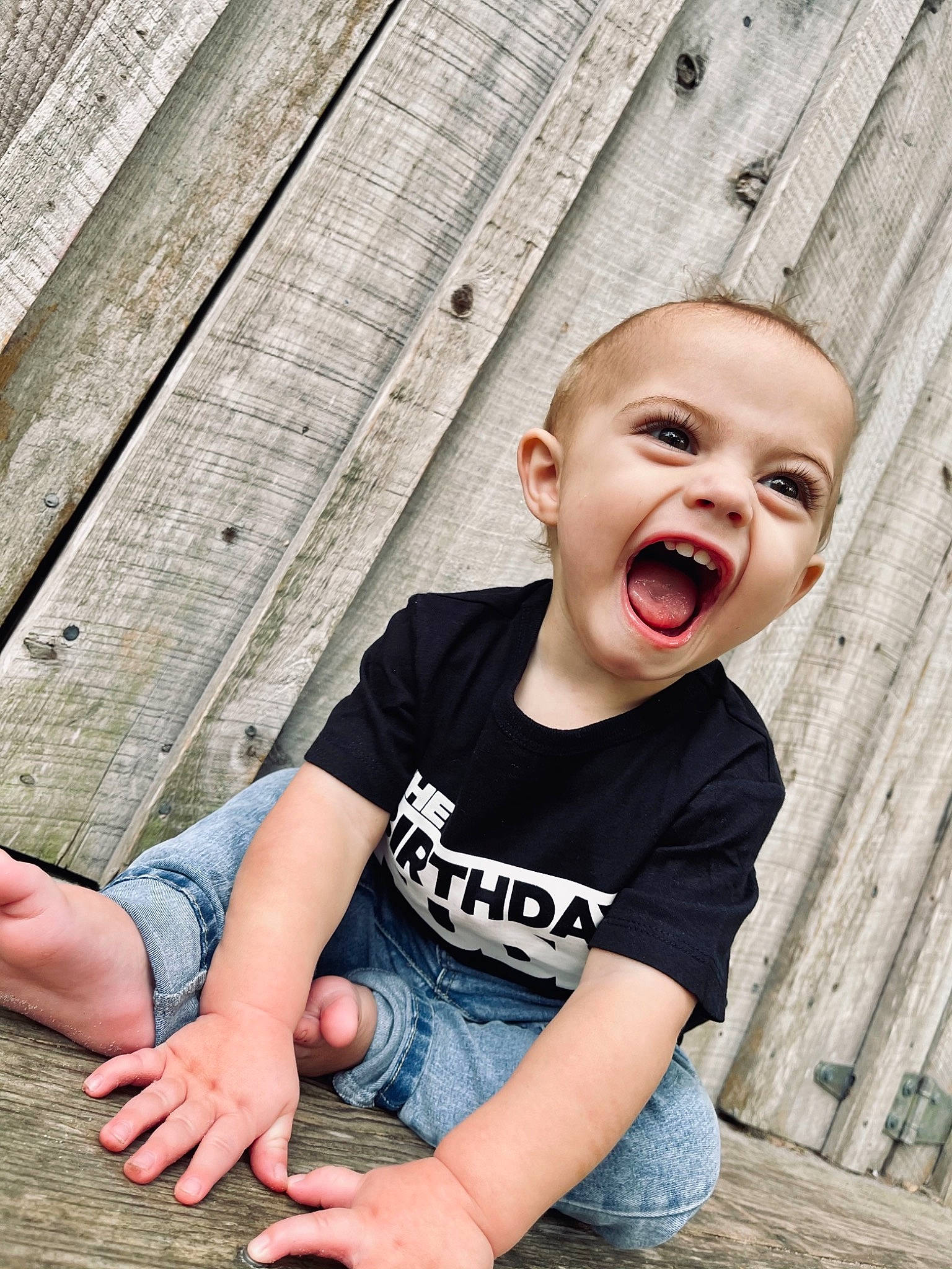 Conway is registered to the contest to win money with this photo: cool, flash_photography, grass, hairstyle, happy, human, jeans, leaf, leg, people, people_in_nature, person, photograph, skin, sleeve, smile, standing, summer, t_shirt, toddler