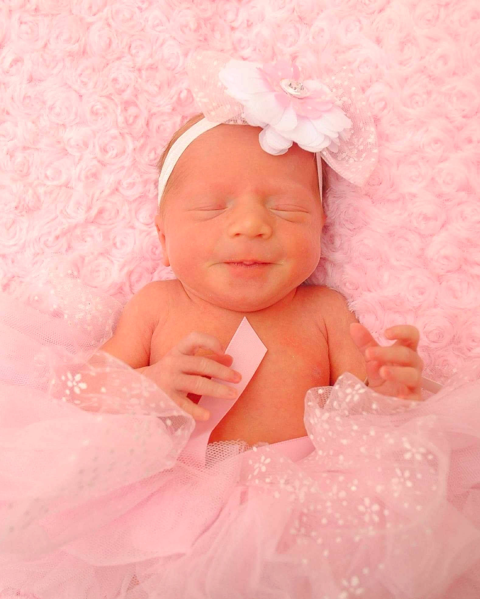 Novalynn joined the competition — help win amazing prizes! baby, cheek, child, eye, face, hair_accessory, head, headgear, headpiece, person, photograph, photography, pink, product, skin, smile, toddler