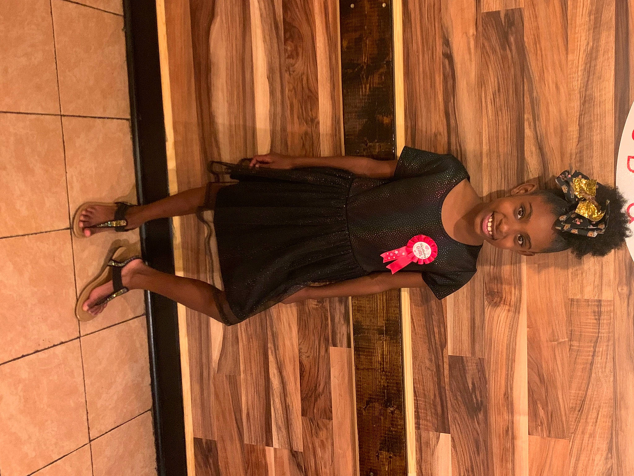 Izzy joined the competition — help win amazing prizes! elbow, flooring, hardwood, hat, home_door, human_leg, joy, knee, pattern, person, plank, red, room, street_fashion, thigh, varnish, waist, wood, wood_stain, wrist