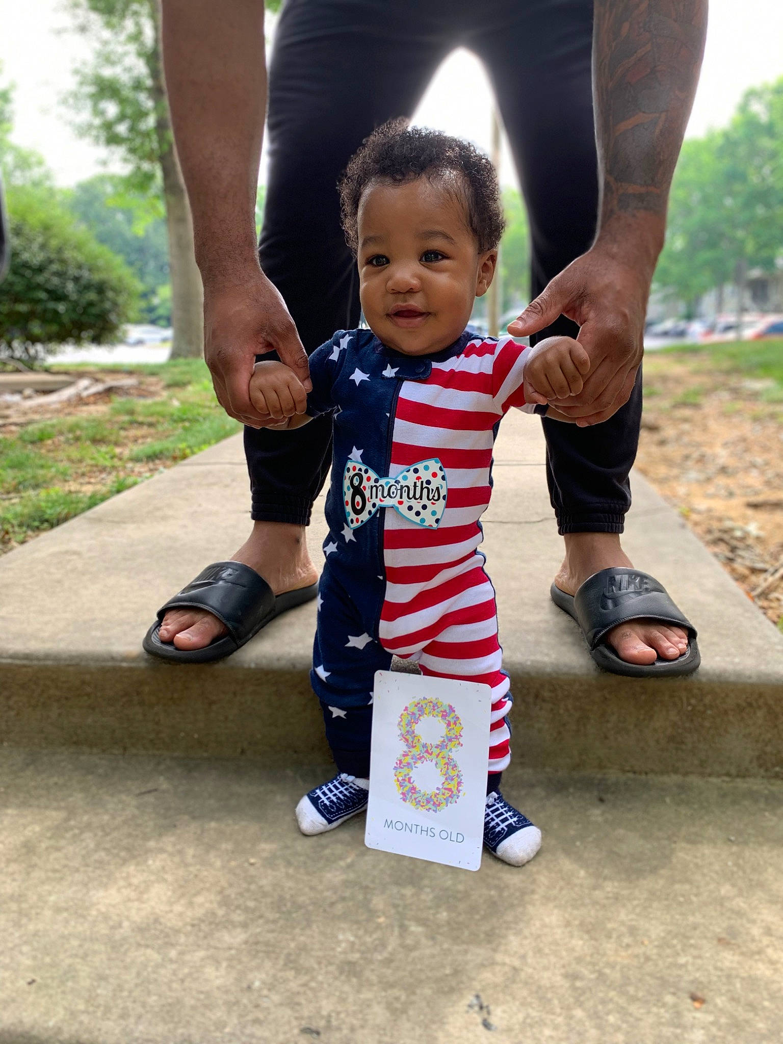 Michael Jr joined the competition — help win amazing prizes! child, footwear, fun, gesture, grass, happy, human_leg, joint, knee, leisure, person, plant, recreation, sandal, shoe, shorts, smile, sneakers, t_shirt, thigh