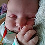 baby, blanket, child, close_up, clothing, comfort, cute, face, hand, indoors, infant, newborn, peaceful, portrait, rest, skin, sleeping, soft, toddler, young