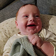 Reginald joined the competition — help win amazing prizes! baby, blanket, child, clothing, comfort, couch, cozy, cute, fabric, face, furniture, hand, happy, indoor, infant, portrait, smile, soft, star_pattern, toddler