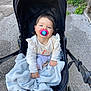 Lorianna participe au concours pour gagner de l'argent avec cette photo : toddler, child, pacifier, stroller, blanket, outdoor, pavement, greenery, baby, person, cute, clothing, hand, toy, relaxing, portrait, infant, casual, daylight, smiling