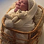 Remi is registered to the contest to win money with this photo: baby, basket, blanket, child, cozy, crocheted_toy, cute, furniture, handmade, infant, knitwear, newborn, portrait, resting, sleeping, smile, soft_lighting, studio, teddy_bear, warm