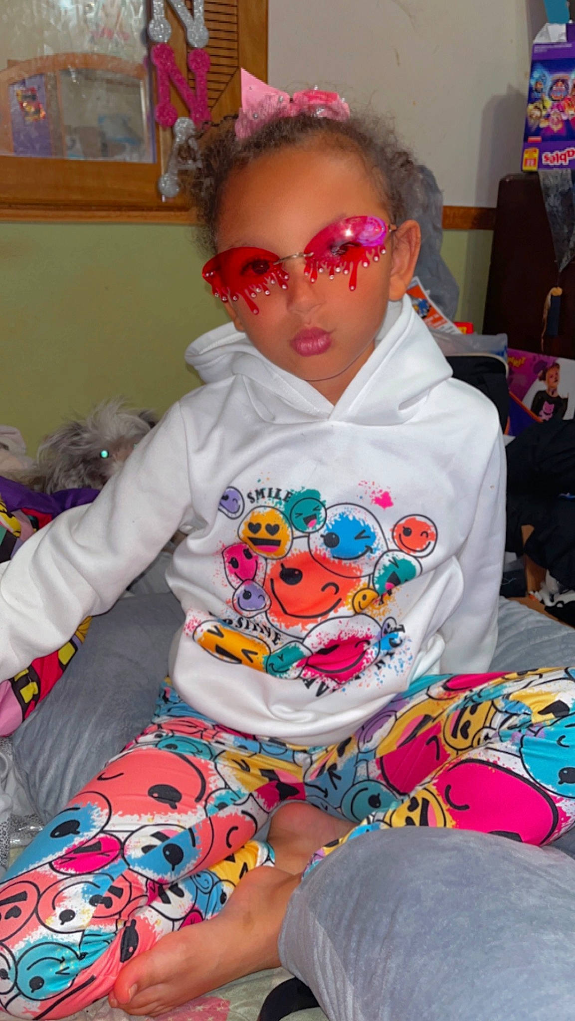 Ktianna is registered to the contest to win money with this photo: baby_toddler_clothing, cheek, child, cool, event, eyewear, fashion_design, fun, goggles, lap, necklace, pattern, person, pink, sitting, sleeve, sunglasses, t_shirt, thigh, toddler