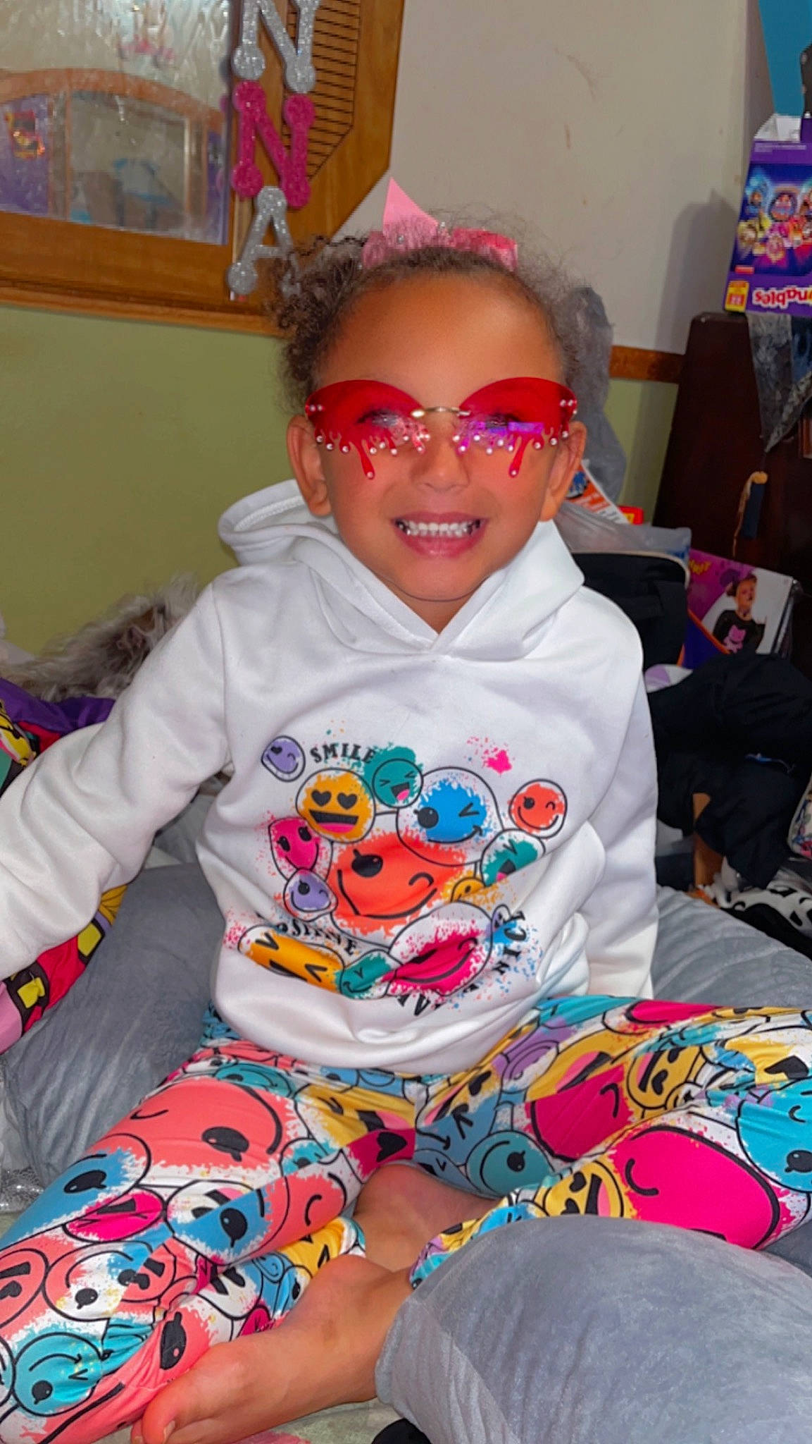 Ktianna joined the competition — help win amazing prizes! art, baby_toddler_clothing, child, event, eyewear, fun, glasses, goggles, happy, joy, linens, pattern, person, pink, room, sitting, sleeve, smile, sunglasses, t_shirt