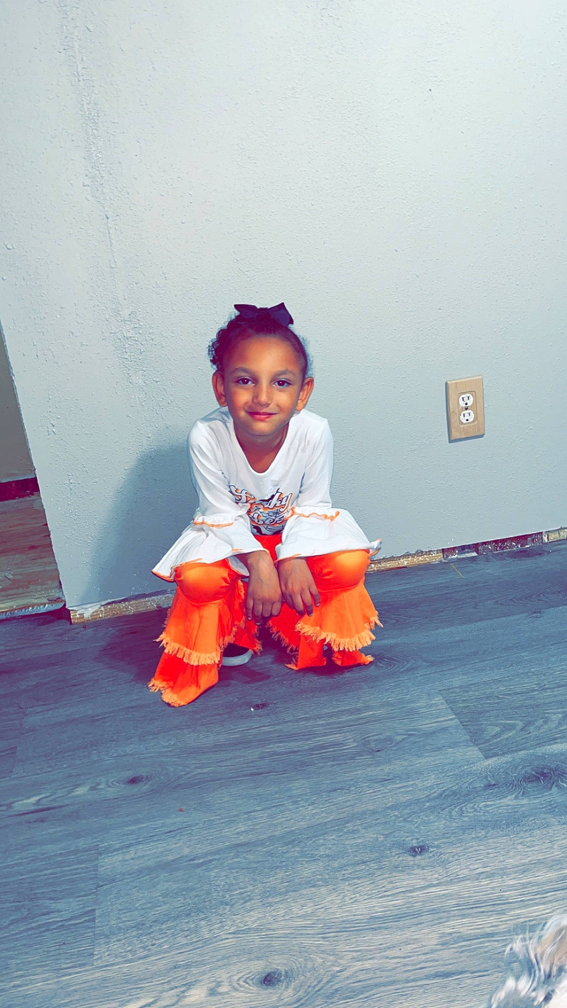 Ktianna joined the competition — help win amazing prizes! baby_toddler_clothing, child, costume, eye, face, floor, flooring, fun, happy, human_leg, joy, leisure, person, room, sitting, sleeve, toddler, tradition, vacation, wood