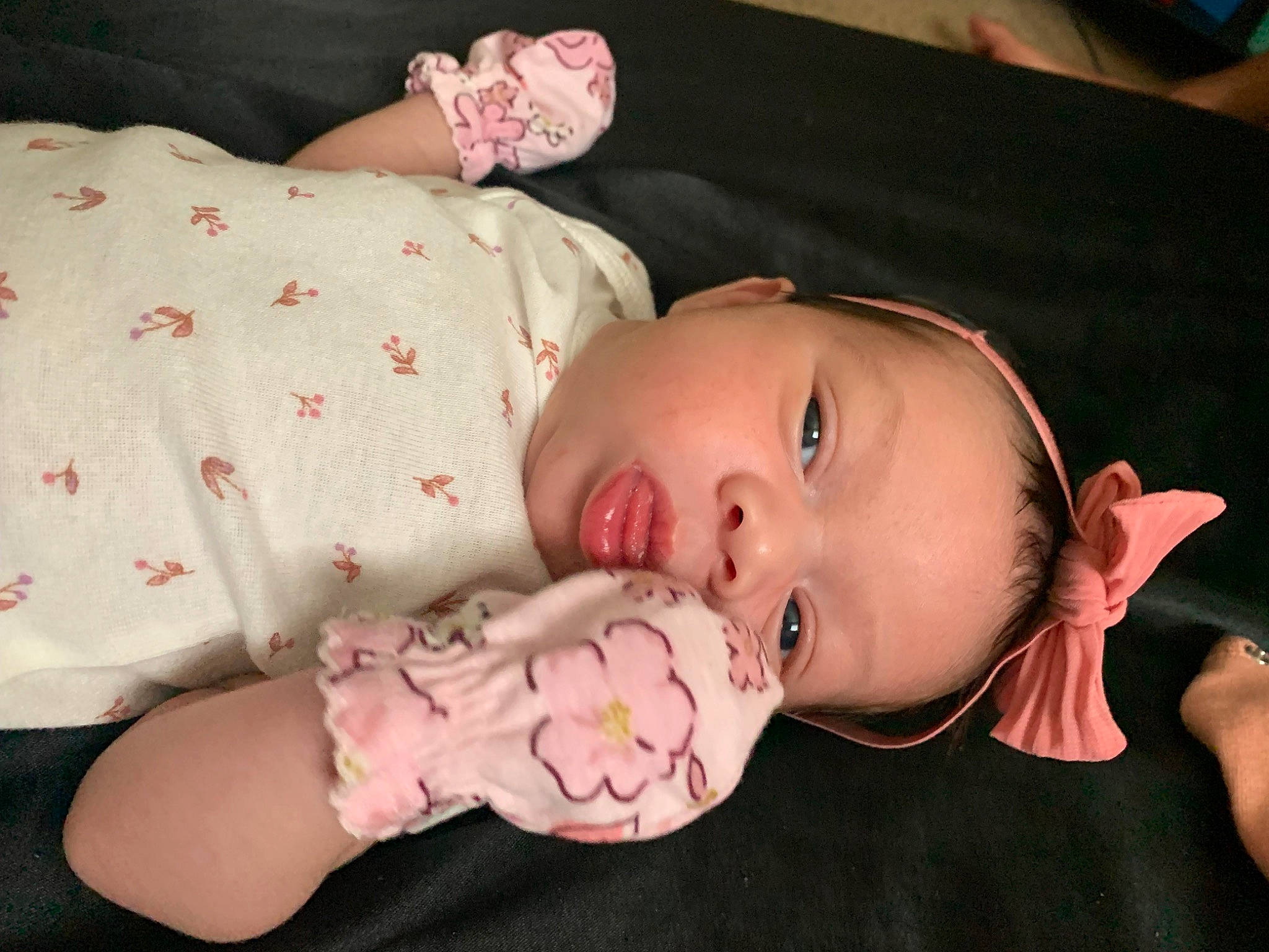 Asiyah is registered to the contest to win money with this photo: baby, baby_products, baby_toddler_clothing, cheek, comfort, dress, ear, eyelash, finger, headgear, human_body, iris, lip, mouth, nose, person, pink, skin, sleeve, textile