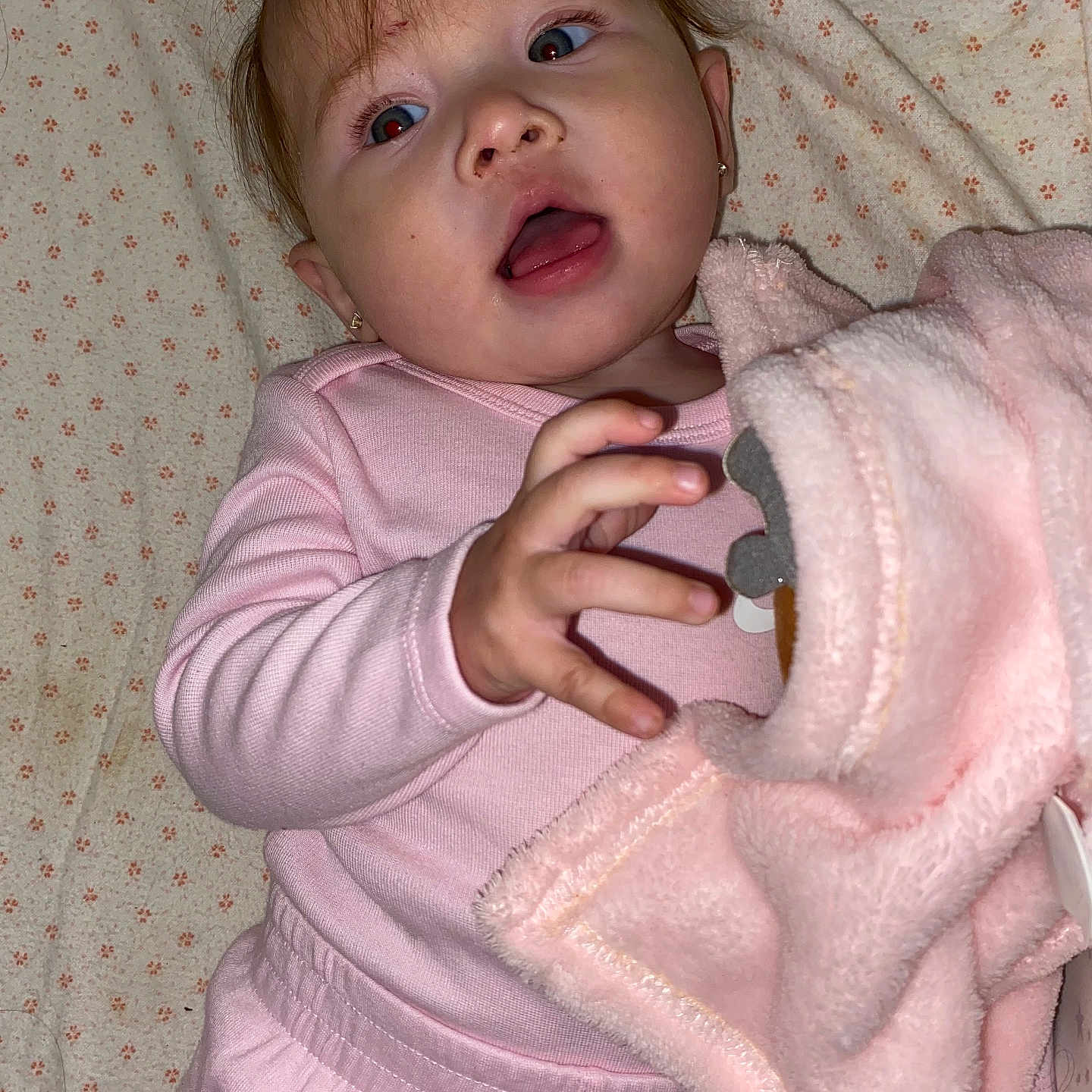 Lilly joined the competition — help win amazing prizes! baby, bed, blanket, bodypart, clothing, coat, couch, face, finger, furniture, hand, happy, head, jacket, newborn, person, photography, portrait, quilt, smile