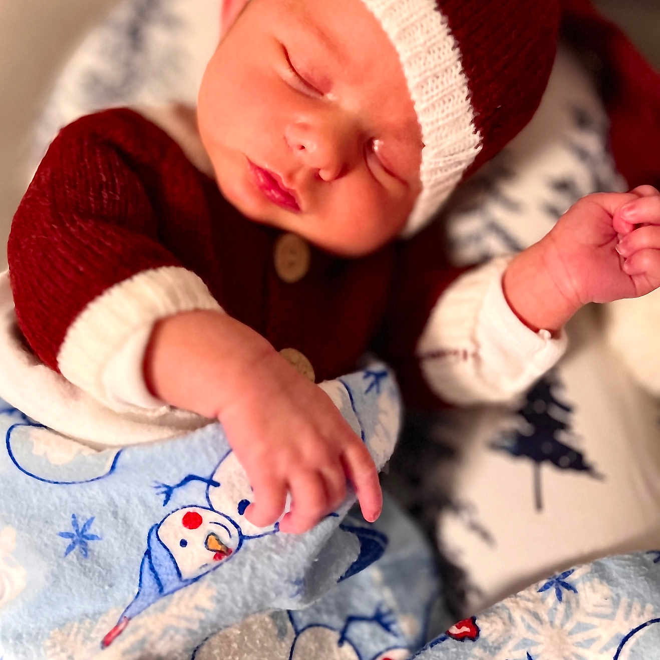 Kaymen is registered to the contest to win money with this photo: baby, blanket, child, cozy, cute, holiday, indoors, infant, knit_hat, newborn, peaceful, portrait, red_sweater, resting, sleep, sleeping, snowman_pattern, soft, warm, wrapped