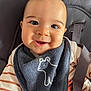 baby, smiling, face, bib, striped_clothing, seat, child, infant, cute, happy, safety_strap, closeup, portrait, indoors, young_child, head, apparel, person, baby_chair, fabric