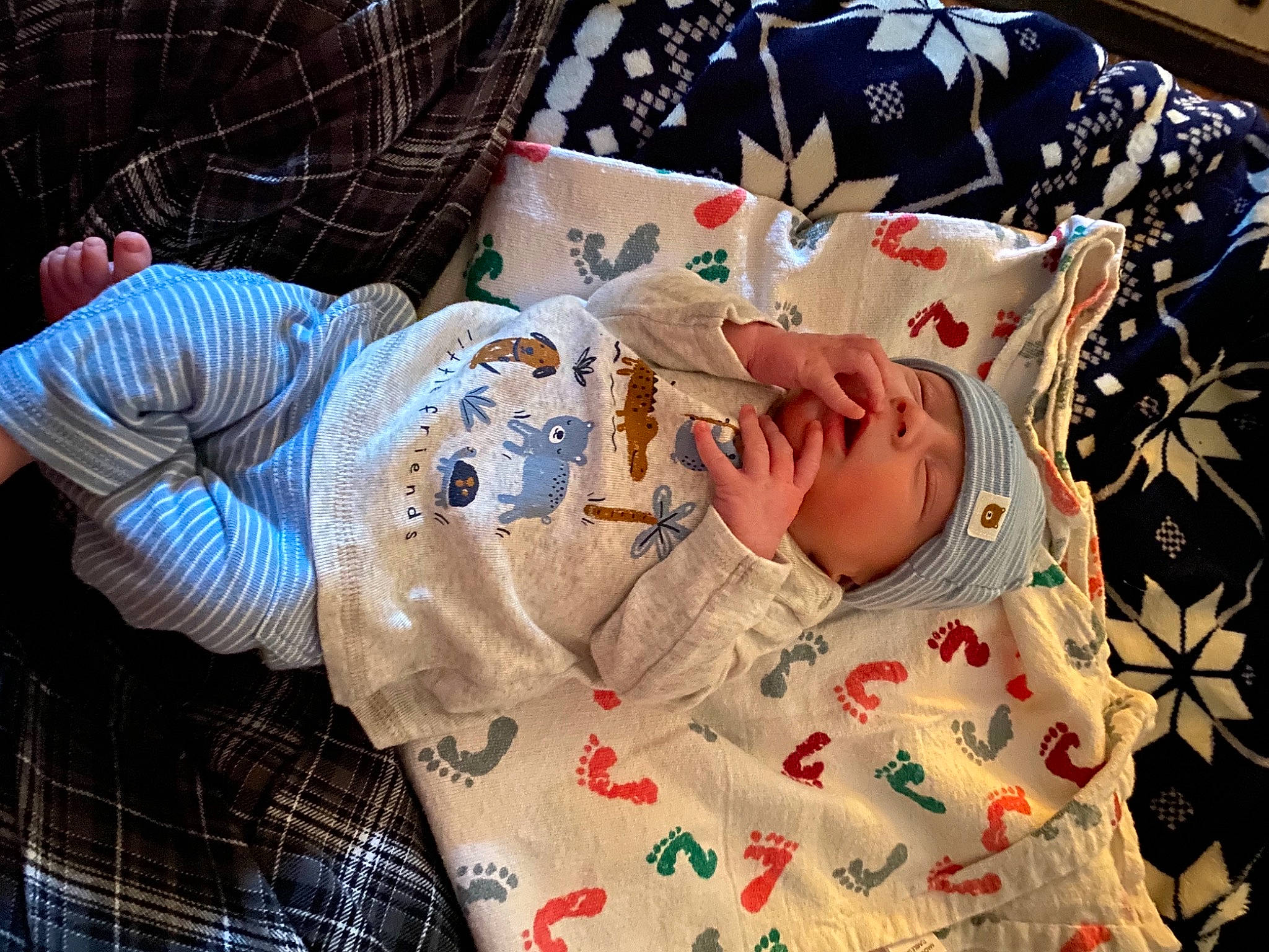 Riley Jr joined the competition — help win amazing prizes! baby, baby_products, baby_toddler_clothing, bedding, carmine, child, comfort, glasses, hat, headwear, linens, pattern, person, plaid, quilt, room, sleeve, t_shirt, tartan, textile