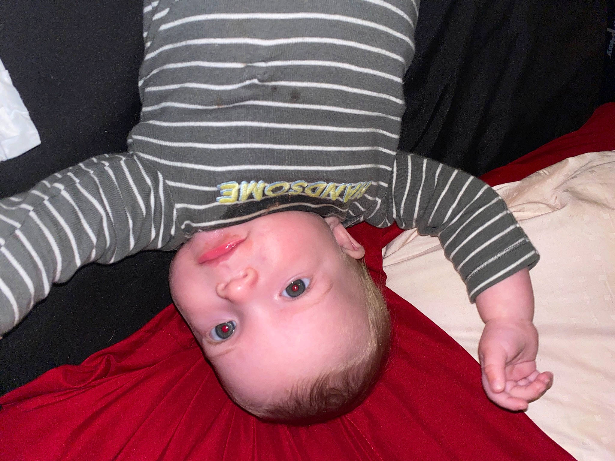 Cooper is registered to the contest to win money with this photo: baby, baby_toddler_clothing, cheek, child, comfort, elbow, eye, finger, fun, gesture, grass, happy, lip, mouth, nose, pattern, person, sitting, skin, sleeve