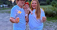 Sophia joined the competition — help win amazing prizes! baby, child, couple, sparklers, outdoor, evening, nature, smiling, family, casual_clothing, redhead, jeans, shorts, grass, trees, dirt_road, portrait, happy, people, summer