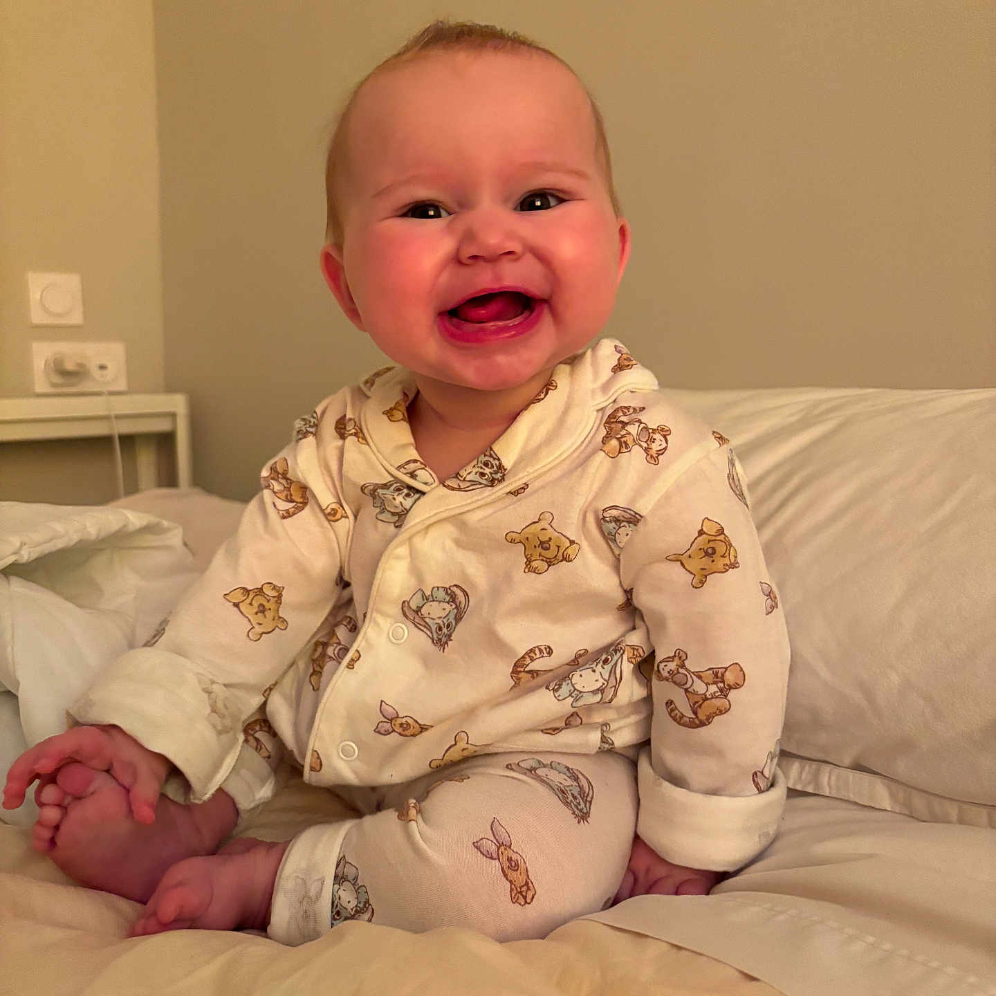 Isla joined the competition — help win amazing prizes! baby, child, pajamas, bed, smile, happy, infant, cute, indoors, face, person, foot, hand, sleepwear, animal_print, crawling, cozy, portrait, skin, young