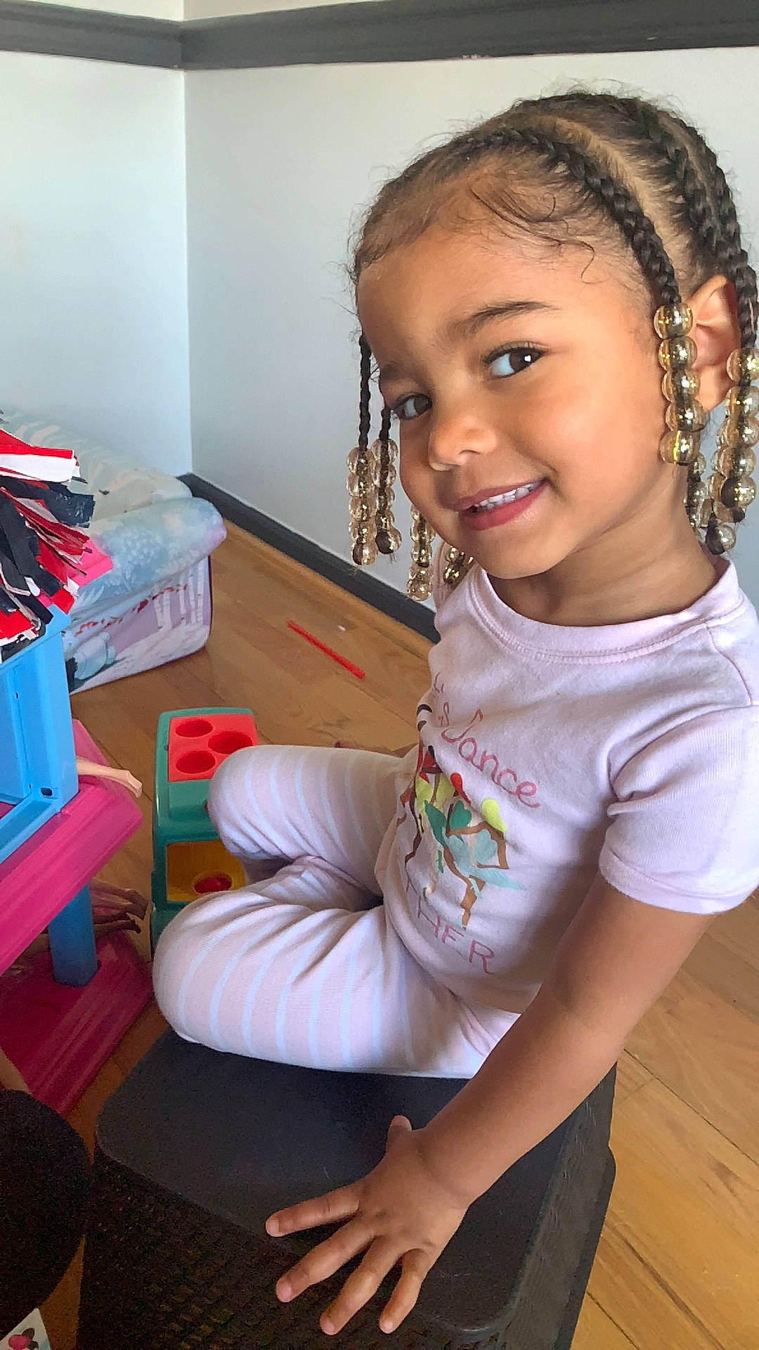 Nadia joined the competition — help win amazing prizes! black_hair, child, chin, cornrows, dreadlocks, elbow, fun, hairstyle, happy, human_body, human_leg, jewellery, joy, knee, long_hair, neck, person, sitting, skin, smile