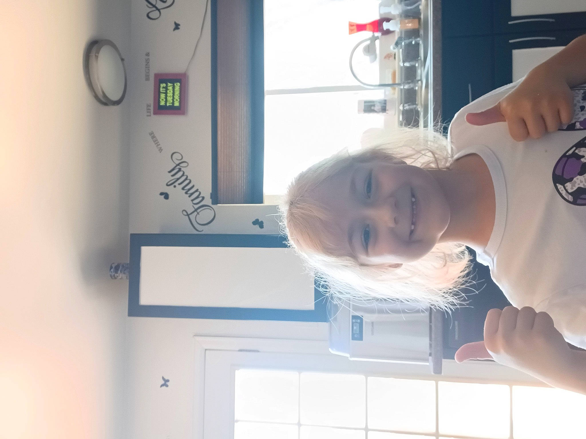 Anabella is registered to the contest to win money with this photo: elbow, gas, hat, joy, machine, major_appliance, person, room, smile, t_shirt, tire, toddler, wheel