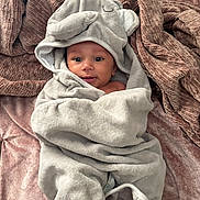 Chosen joined the competition — help win amazing prizes! baby, towel, hood, elephant, blanket, soft, texture, cute, infant, smile, face, eyes, lying_down, wrapped, cozy, indoors, person, child, happy, plush