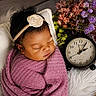 Ja'Sandra joined the competition — help win amazing prizes! baby, sleeping, blanket, headband, flower, pillow, clock, flowers, purple, white, cushion, infant, peaceful, wrapped, decor, wood_floor, soft_texture, portrait, newborn, cozy