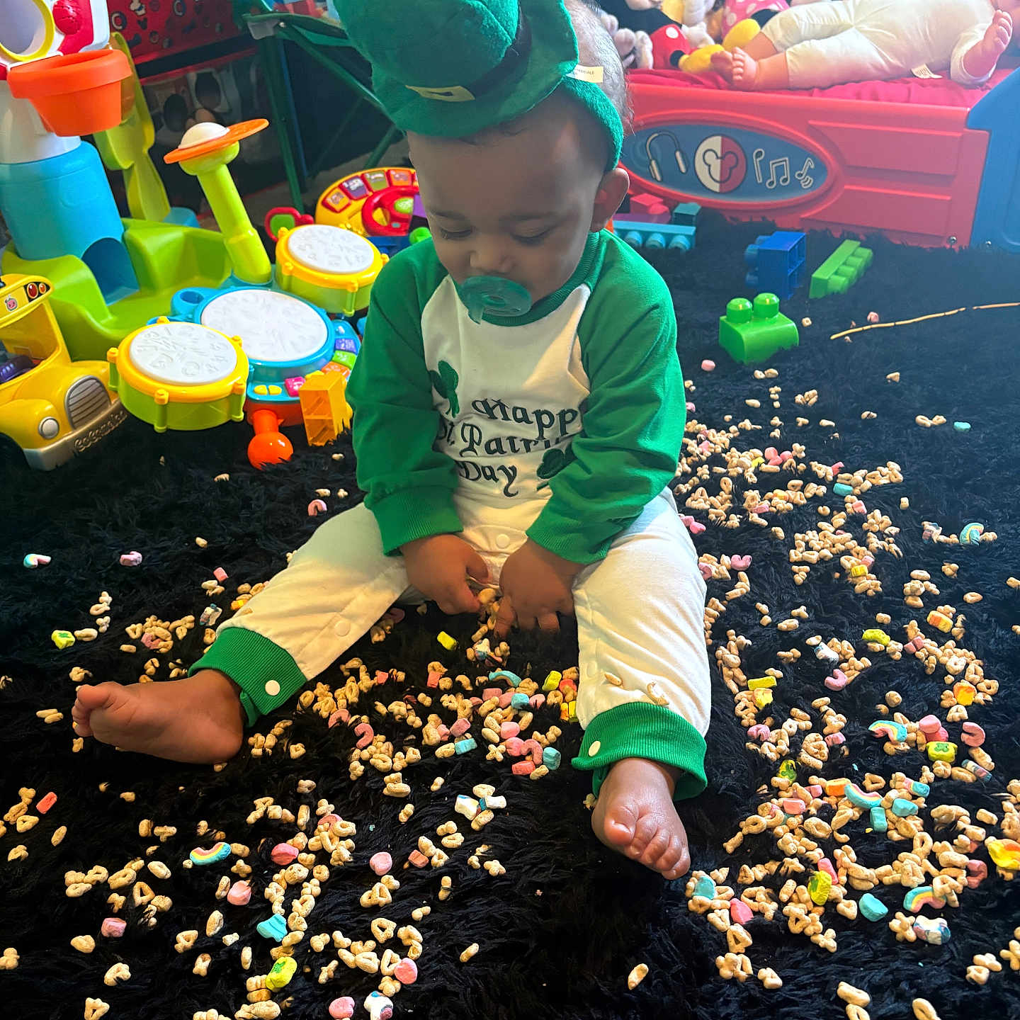 Kylan is registered to the contest to win money with this photo: baby, bodypart, boy, child, clothing, face, finger, food, hand, hat, head, indoors, male, paper, person, photography, playarea, portrait, sphere, sweets