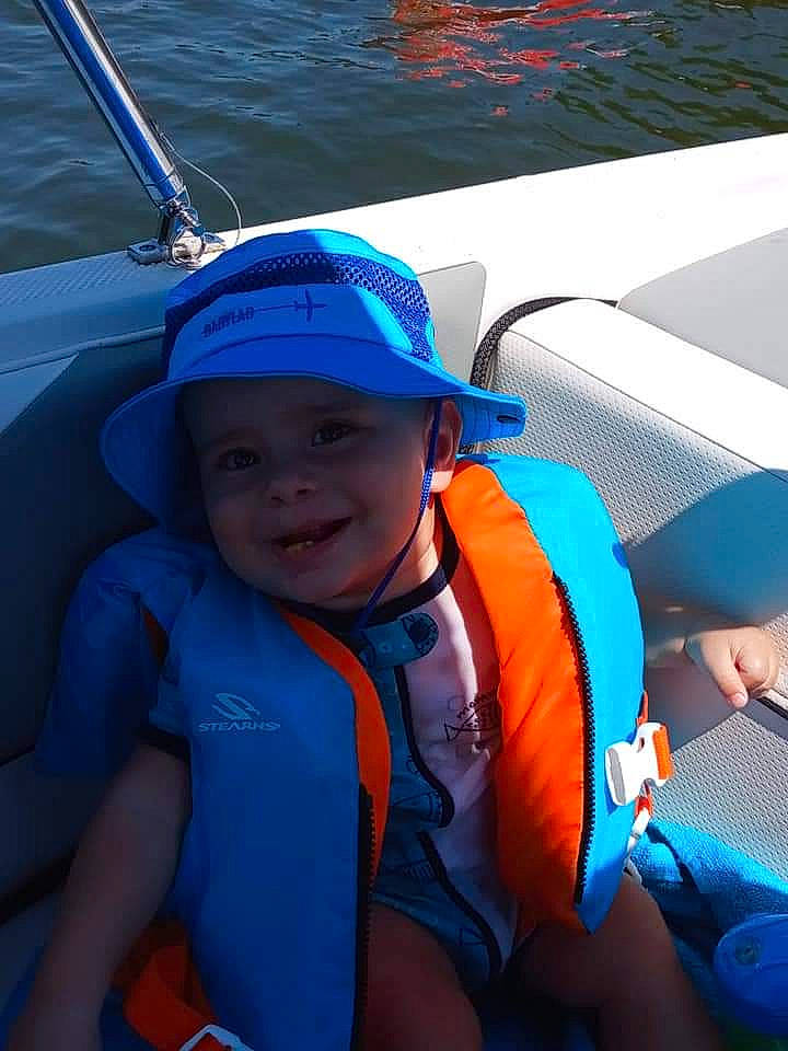 U'Nique joined the competition — help win amazing prizes! boating, boats_and_boating_equipment_and_supplies, child, electric_blue, fun, headgear, headwear, joy, lifejacket, person, personal_protective_equipment, recreation, sailing, smile, toddler, under_exposed, vacation, vehicle, wetsuit