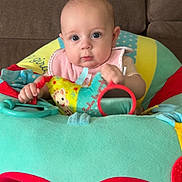 Nina participe au concours pour gagner de l'argent avec cette photo : baby, infant, child, couch, play_seat, toy, bib, portrait, indoor, blue_eyes, looking_at_camera, sitting, colorful, mirror, hands, sock, plush, fabric, soft_toys, cute