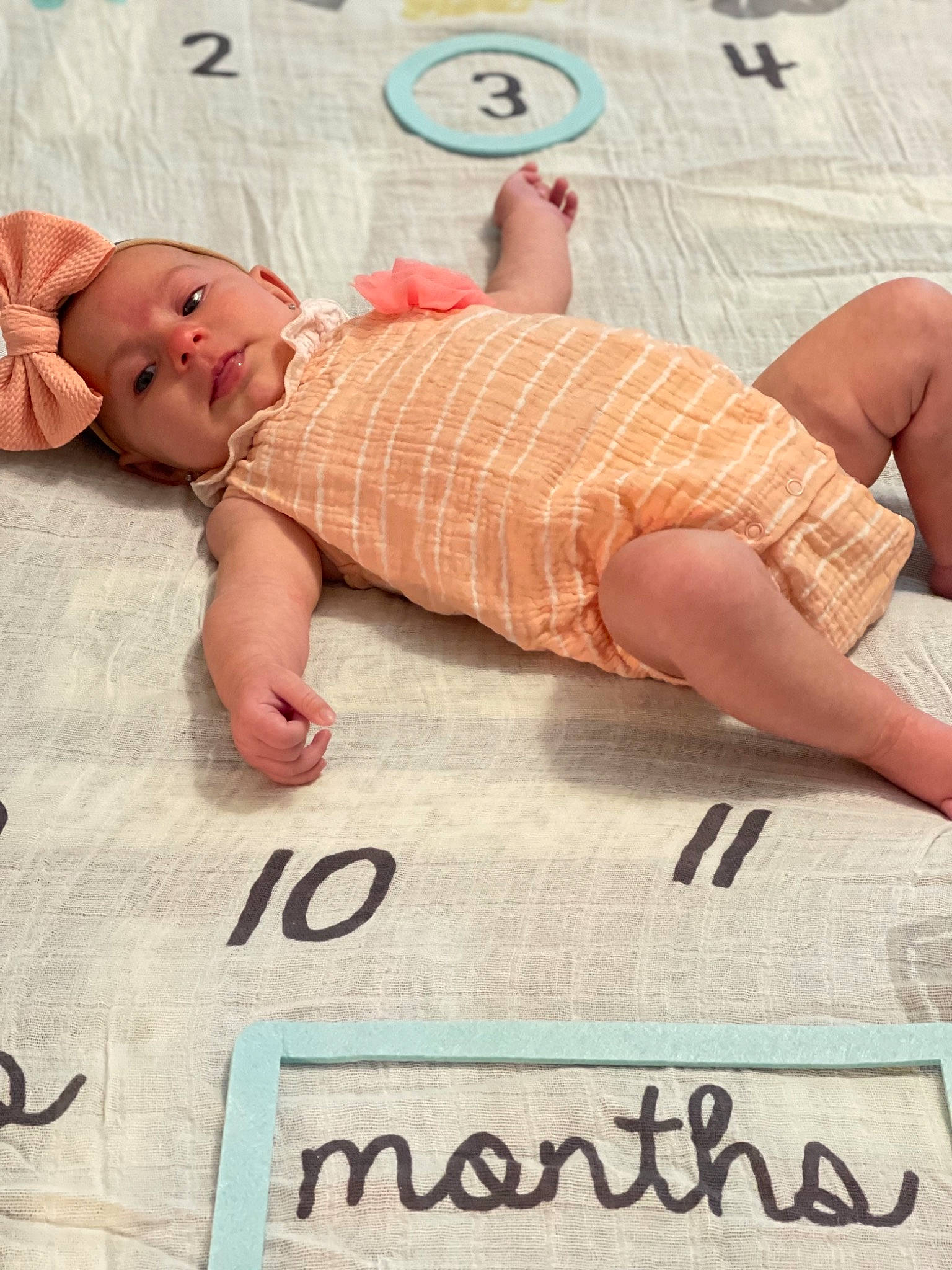 Gwendolyn joined the competition — help win amazing prizes! baby, baby_toddler_clothing, bedding, comfort, finger, flooring, font, head, human, human_leg, illustration, joint, linens, pattern, person, pink, skin, textile, thigh, toddler