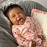 Kalani joined the competition — help win amazing prizes! baby, infant, smiling, happy, sleepwear, onesie, floral_pattern, blanket, soft, cozy, cute, lying_down, indoor, child, portrait, person, comfort, bed, rest, joy