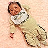 Kalani joined the competition — help win amazing prizes! baby, infant, child, cute, pink_rug, fluffy, bib, mamas_mini, beige_outfit, leopard_print, bow, relaxed, lying_down, soft_texture, small_hands, socks, adorable, portrait, indoors, fashion