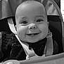 baby, baby_toys, black_and_white, child, childcare, closeup, cute, face, happy, high_chair, indoor, infant, person, playtime, portrait, seat, seatbelt, smile, toy, young