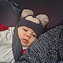 Lylio participe au concours pour gagner de l'argent avec cette photo : baby, car_seat, child, closeup, clothing, cozy, cute, expression, face, hat, headwear, indoor, infant, knitwear, person, portrait, seatbelt, sitting, warm_clothing, young_child