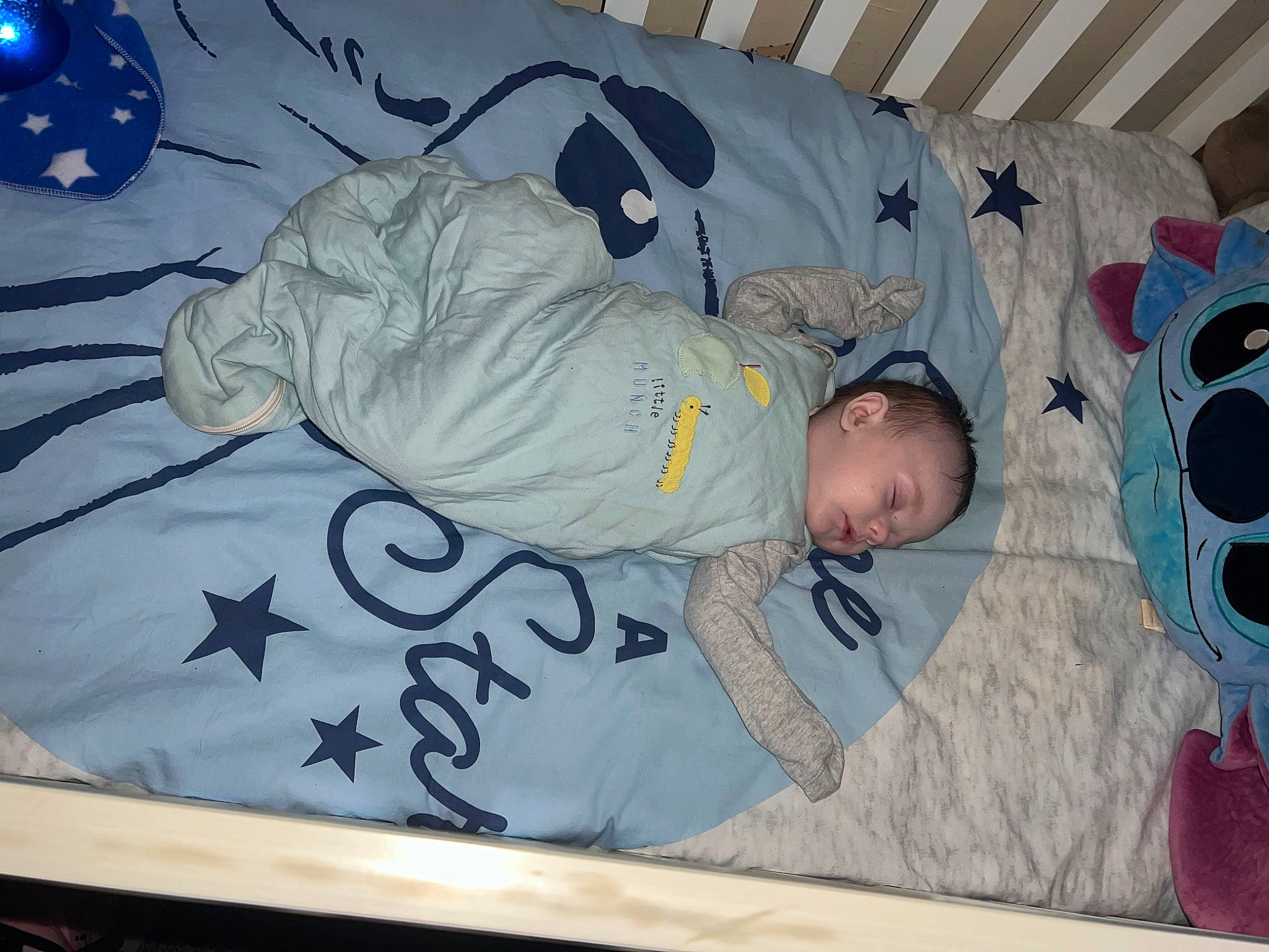 Leighton is registered to the contest to win money with this photo: baby, baby_products, baby_safety, baby_toddler_clothing, bed, bedding, bedtime, blue, child, comfort, electric_blue, linens, nap, pattern, person, room, sleep, sleeve, t_shirt, toddler