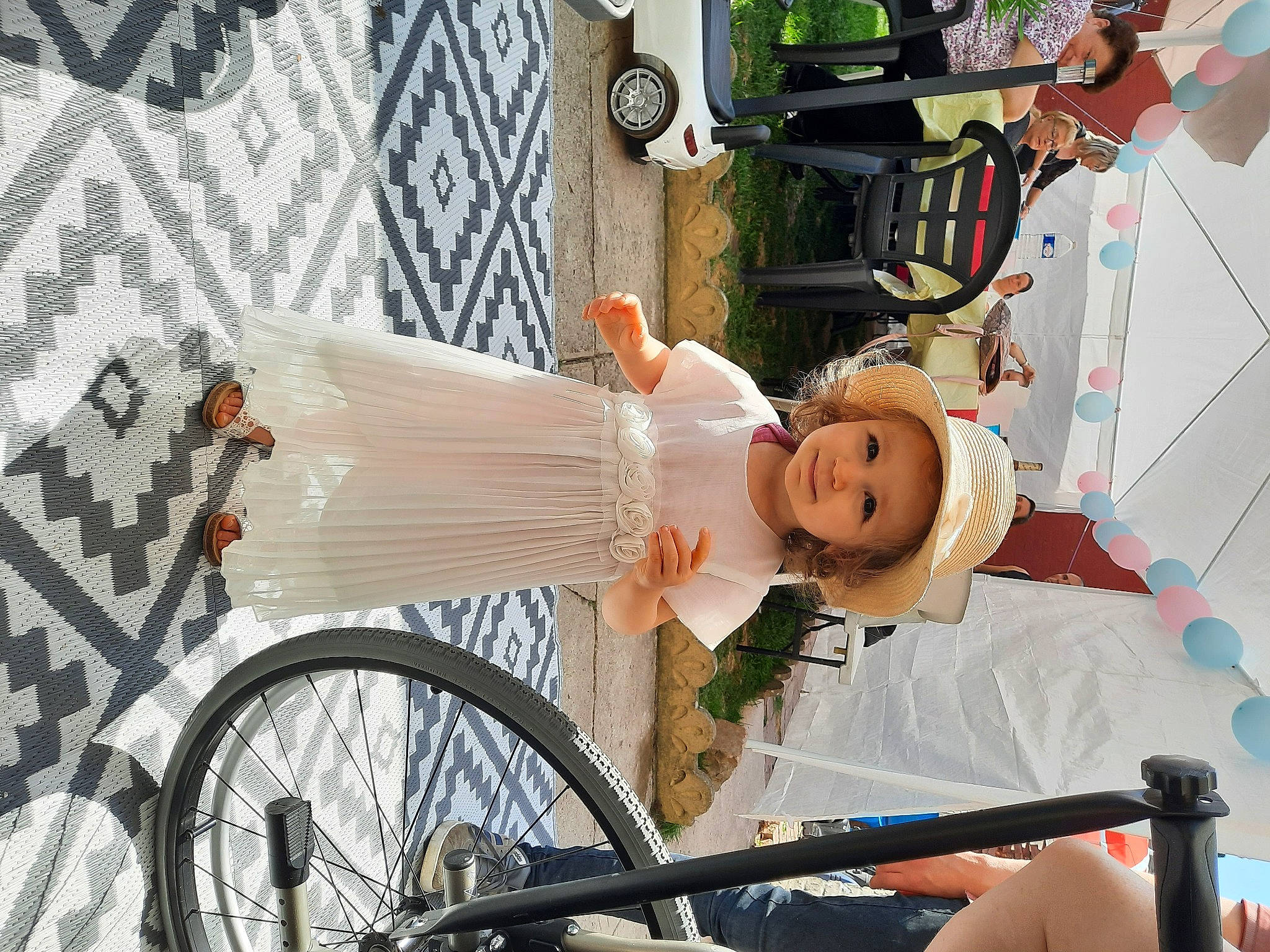 Lyana a rejoint le concours — aidez-le/la à gagner de superbes lots ! baby, bicycle, bicycle_accessory, bicycle_fork, bicycle_frame, bicycle_handlebar, bicycle_tire, bicycle_wheel, dress, event, fashion, happy, headwear, leisure, person, recreation, smile, tire, toddler, tree