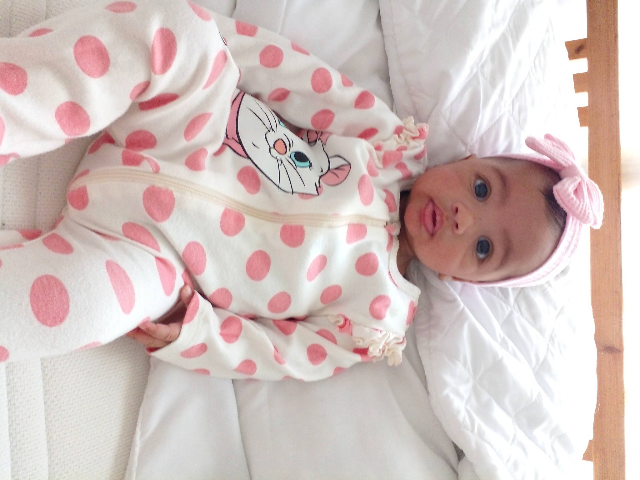 Anastasia is registered to the contest to win money with this photo: baby, baby_products, baby_safety, baby_sleeping, baby_toddler_clothing, bed, bed_sheet, bedding, carmine, child, comfort, linens, nightwear, pattern, person, pink, room, skin, sleeve, textile