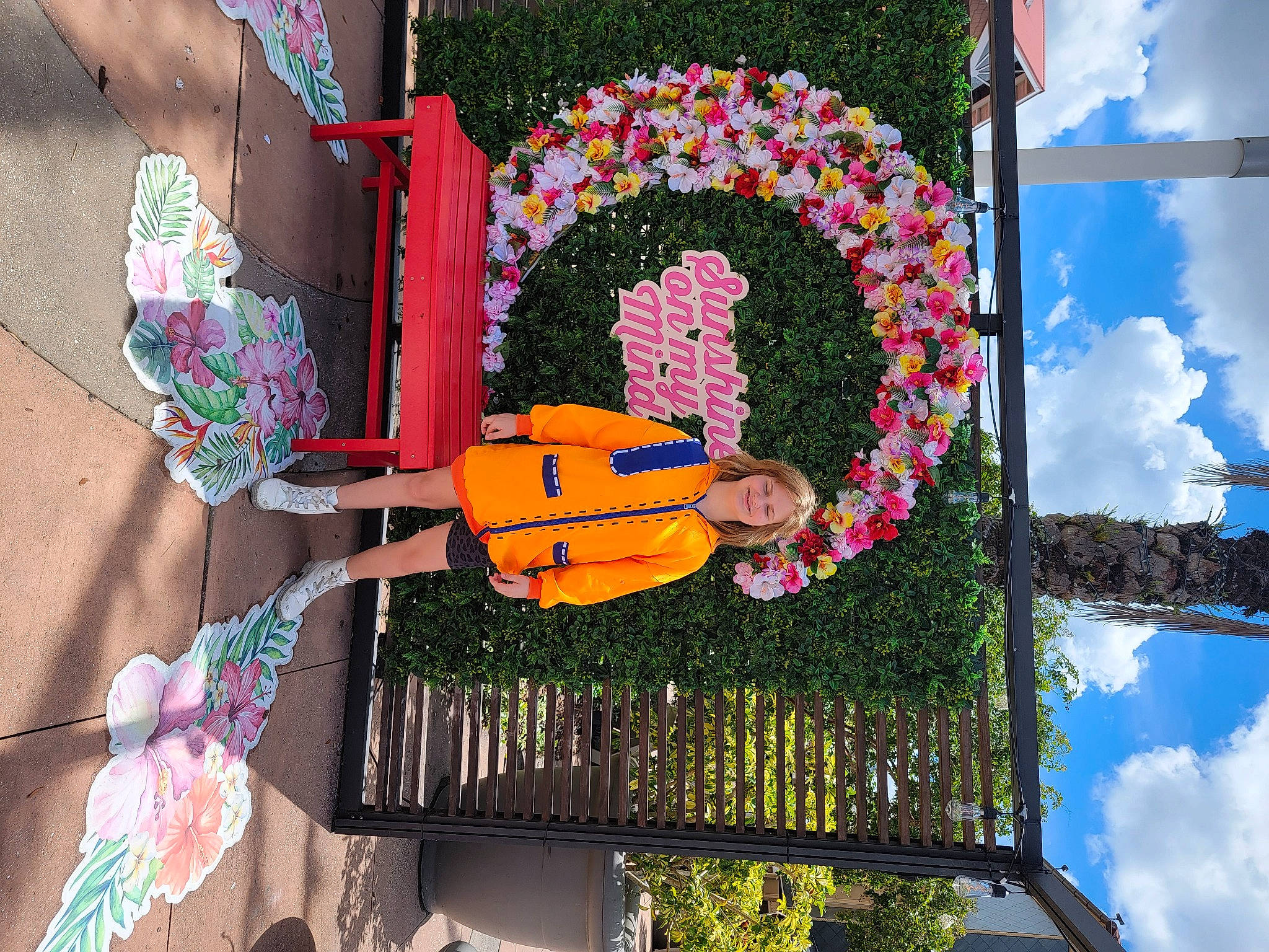 Abygail is registered to the contest to win money with this photo: art, automotive_wheel_system, balloon, cloud, daytime, event, facade, fun, joy, leisure, magenta, mural, party_supply, person, plant, sky, spring, toy, tree, visual_arts