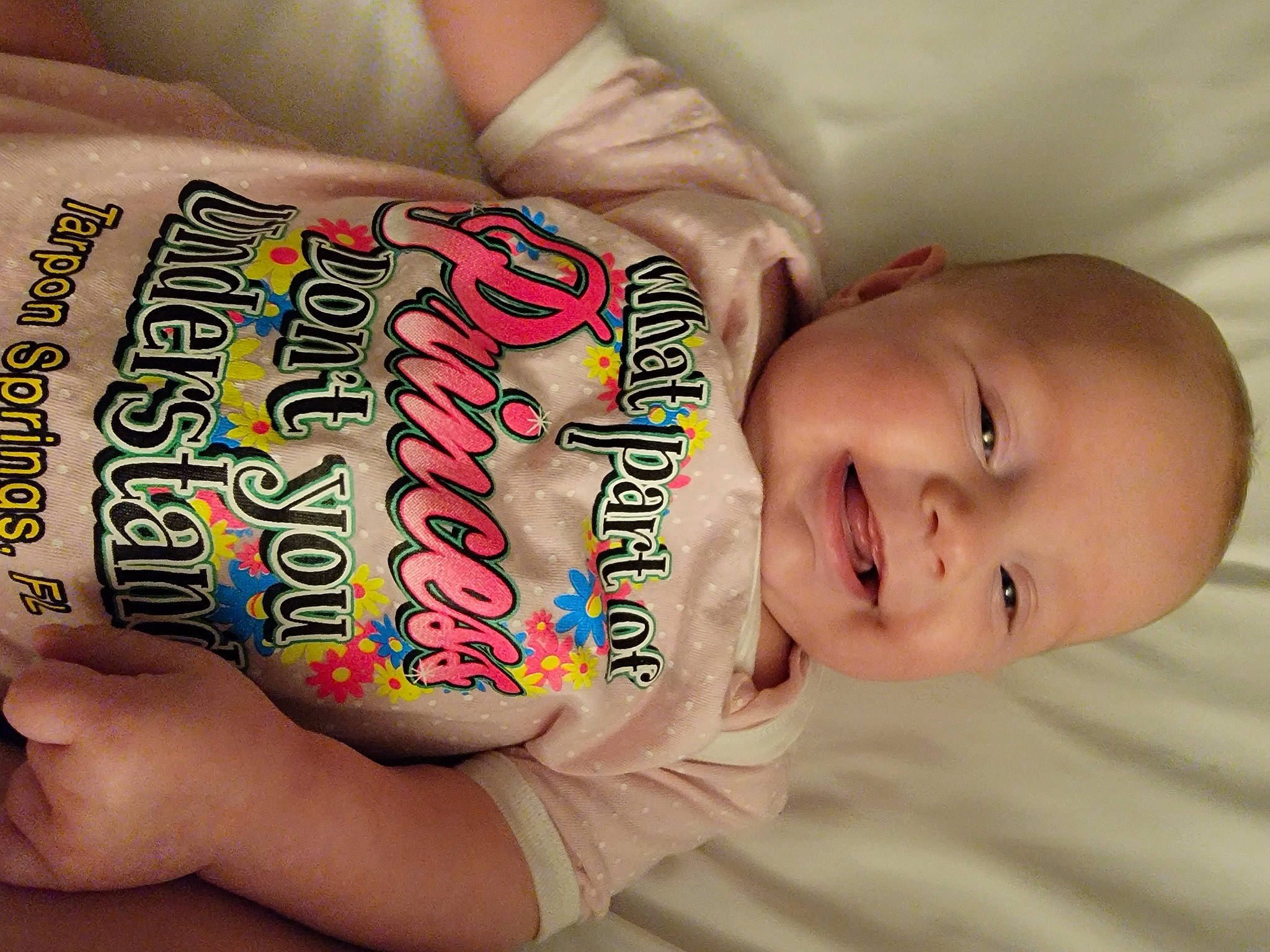 Olivia is registered to the contest to win money with this photo: arm, baby, baby_toddler_clothing, child, comfort, elbow, finger, font, gesture, hand, happy, human_body, mouth, nail, neck, person, skin, smile, thumb, toddler