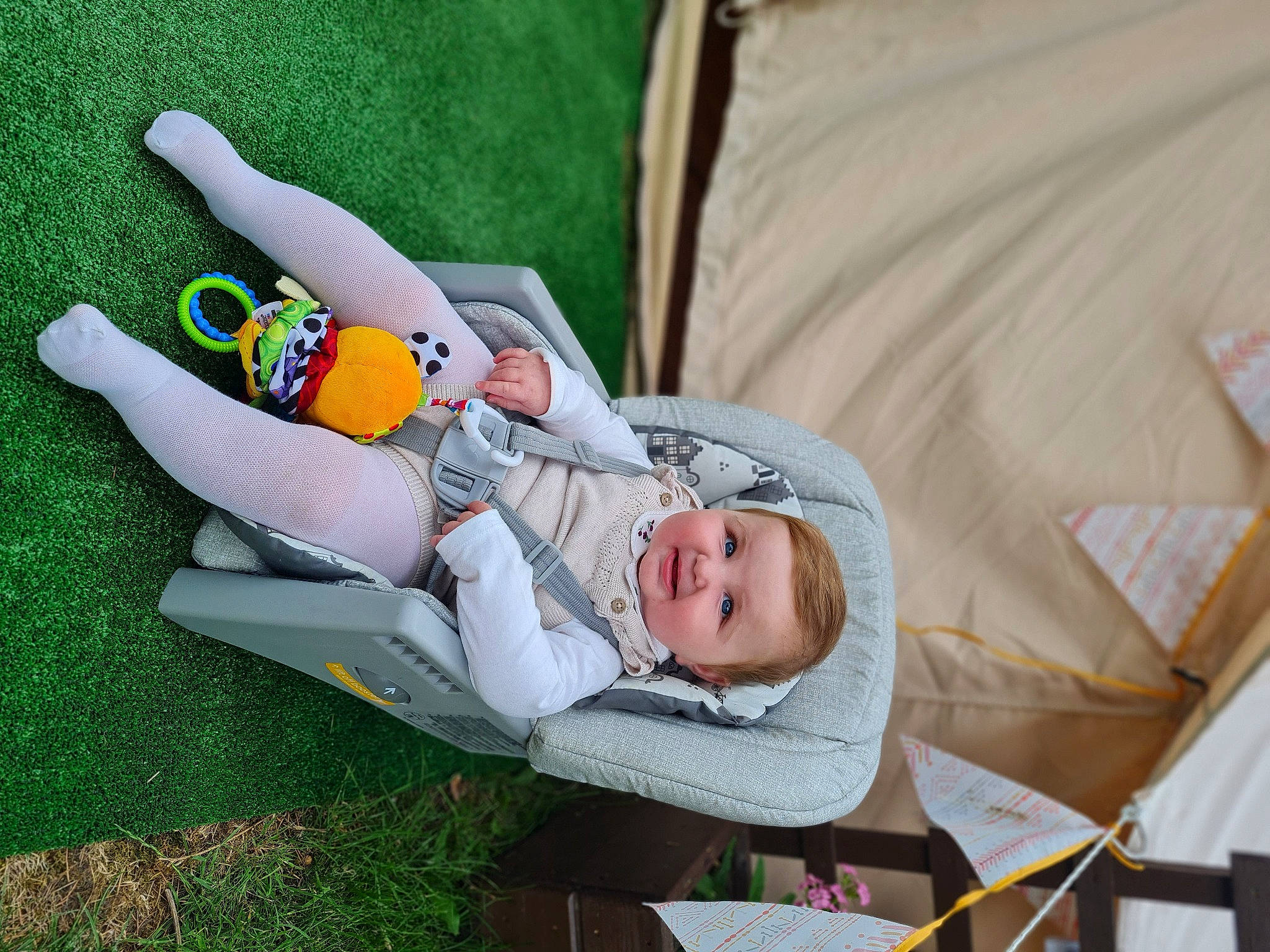 Mabel is registered to the contest to win money with this photo: baby, baby_products, baby_toddler_clothing, chair, child, comfort, couch, fun, grass, happy, lap, leisure, linens, nap, person, recreation, room, sitting, toddler