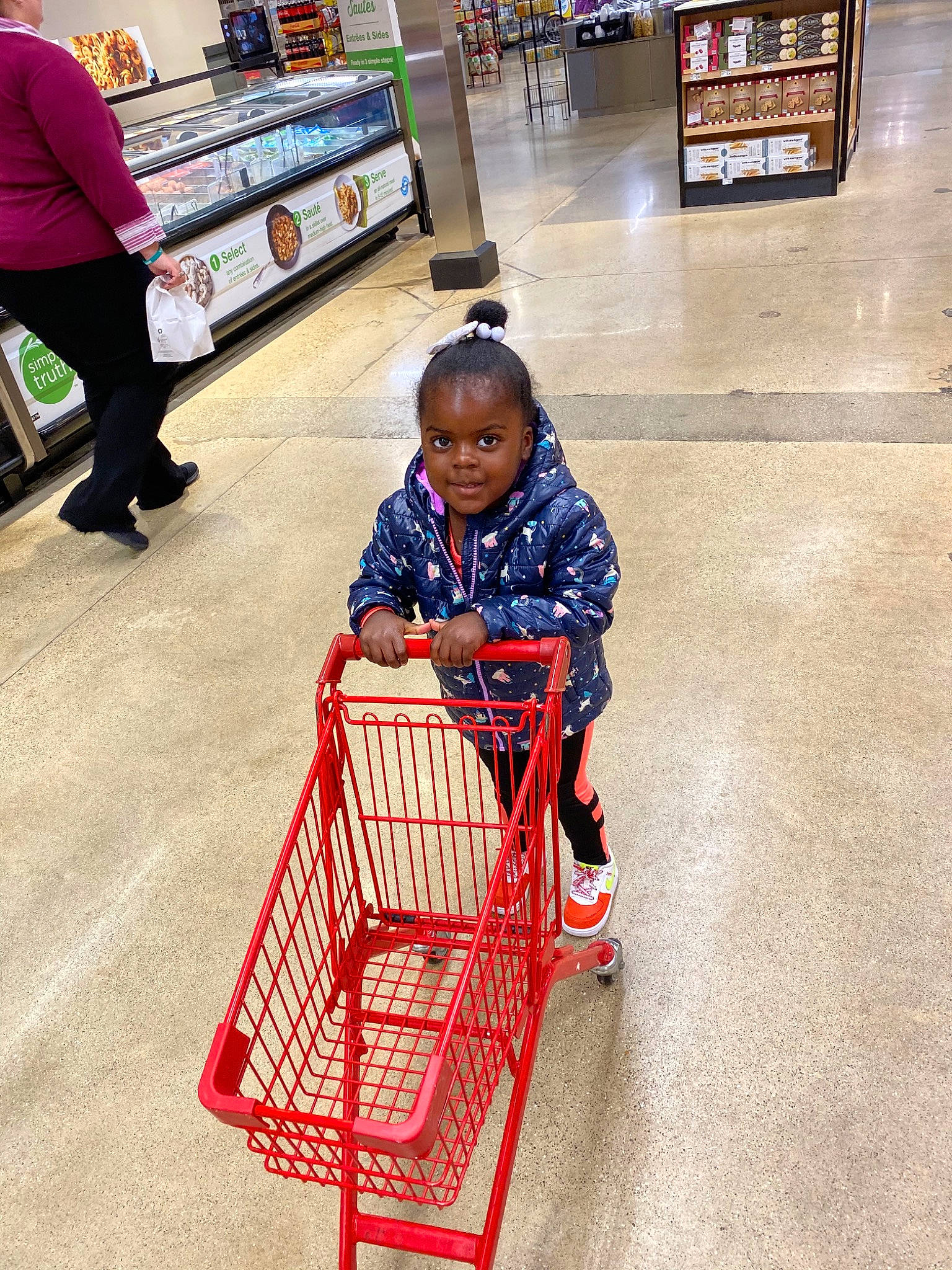 Kelsie joined the competition — help win amazing prizes! aisle, business, cart, child, floor, grocery_store, person, play, retail, shopping, shopping_cart, smile, supermarket, vehicle