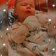 Idalia joined the competition — help win amazing prizes! baby, blanket, clothing, cozy, cute, cute_outfit, face, floral, hand, indoors, infant, pattern, peaceful, plaid, portrait, resting, skin, sleeping, soft, warm