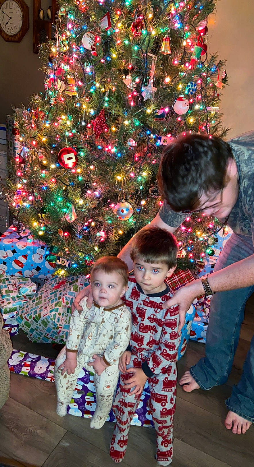 Owen is registered to the contest to win money with this photo: baby, baby_toddler_clothing, child, christmas, christmas_decoration, christmas_eve, christmas_lights, christmas_ornament, christmas_tree, event, holiday, holiday_ornament, human, human_body, interior_design, ornament, people, person, toddler, toy