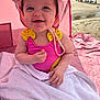 Ivy-Rose joined the competition — help win amazing prizes! baby, beach, child, cute, happy, ocean, outdoor, people_in_background, pink_hat, pink_swimsuit, playful, portrait, sand, smiling, summer, sunlight, tent, towel, vacation, yellow_bows