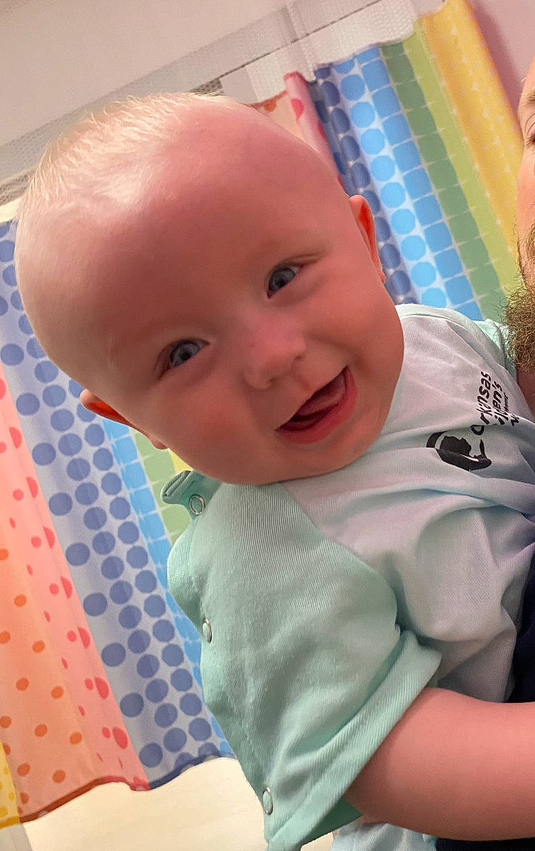 Kamdyn is registered to the contest to win money with this photo: baby, baby_products, baby_toddler_clothing, blue, cheek, child, comfort, fun, happy, iris, linens, nose, pattern, person, pink, room, skin, smile, t_shirt, textile