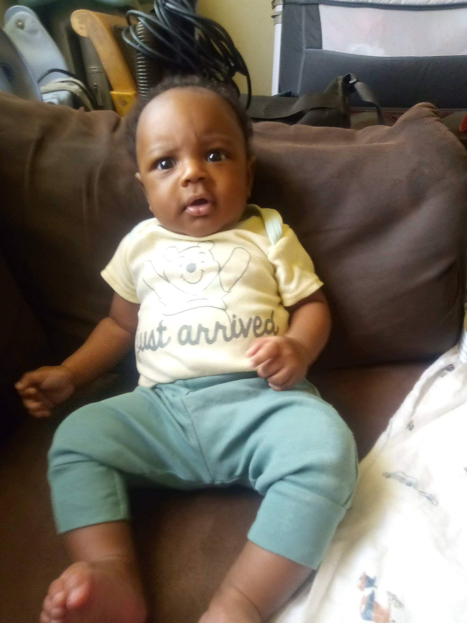 Tamarion joined the competition — help win amazing prizes! baby, baby_toddler_clothing, chair, cheek, child, comfort, couch, eye, foot, fun, human_leg, knee, living_room, person, picture_frame, room, sitting, sleeve, t_shirt, thigh