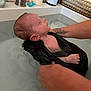 Naël a rejoint le concours — aidez-le/la à gagner de superbes lots ! arm, baby, bath, bathtub, care, cloth, comfort, hand, indoor, infant, pacifier, person, relaxation, sink, skin, support, tattoo, wash, water, young_child
