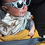 Naël participe au concours pour gagner de l'argent avec cette photo : accessory, baby, bib, blanket, car_seat, child, clothing, cute, face, fashion, hand, indoors, infant, pacifier, portrait, reflection, safety, seatbelt, sunglasses, young
