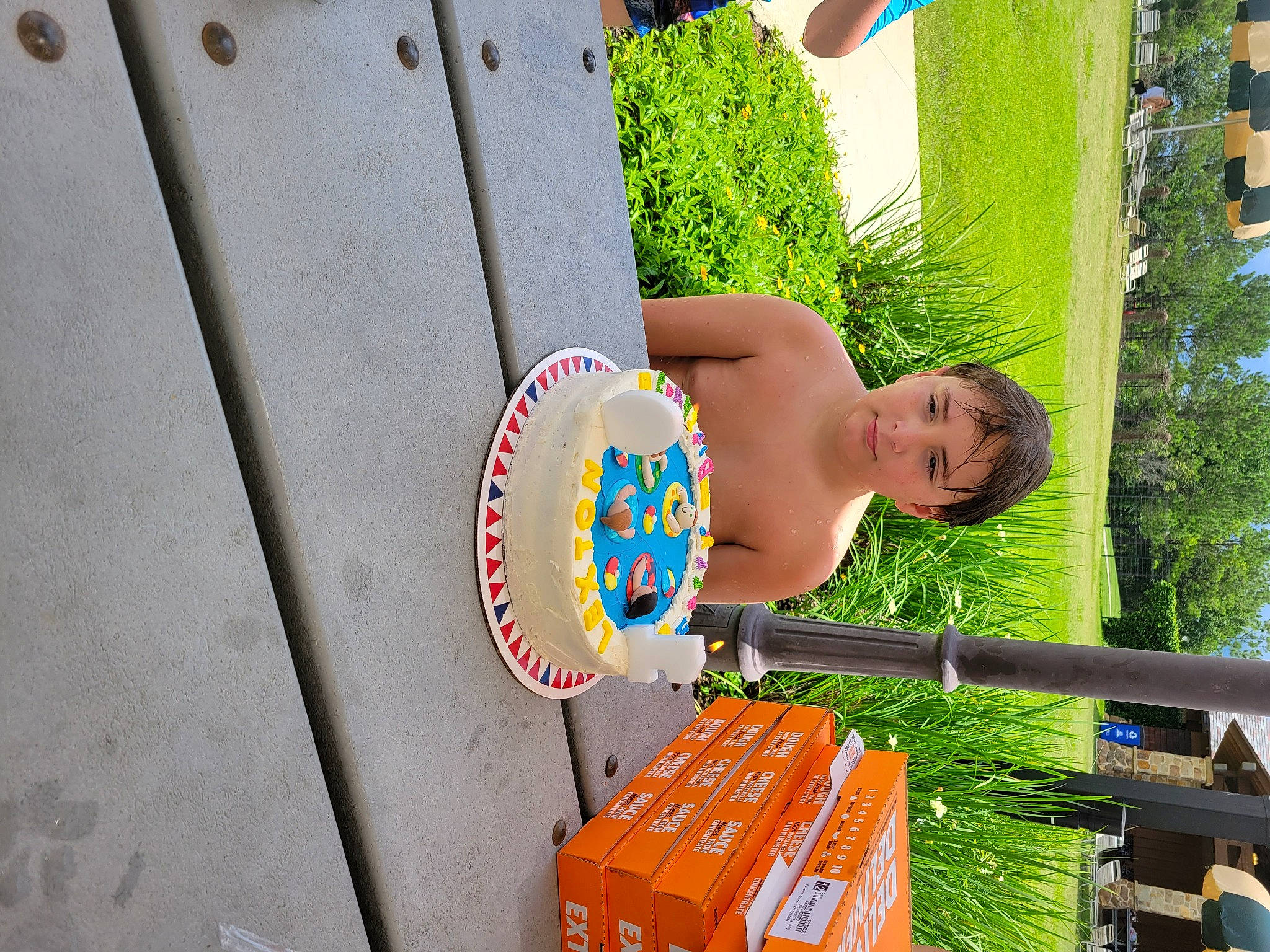 Lexton is registered to the contest to win money with this photo: child, city, fun, grass, happy, house, leisure, outdoor_play_equipment, person, plant, play, recreation, shipping_box, sky, t_shirt, toddler, tree, vacation, wood