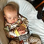 Joni is registered to the contest to win money with this photo: animal_print, baby, baby_seat, child, cozy, cute, fabric, footwear, hands, home, indoor, infant, pacifier, pajamas, pattern, peaceful, resting, sleeping, straps, toddler