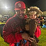 animal_costume, baby, cap, car, casual, child, costume, event, fashion, fun, grass, happy, holding, hoodie, man, night, outdoor, people, portrait, smile