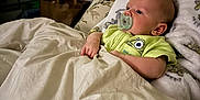 Riley joined the competition — help win amazing prizes! baby, pacifier, bed, blanket, pillow, infant, child, indoors, sleeping, cute, resting, comfort, person, young_child, soft, cozy, sleepwear, room, furniture, relaxation